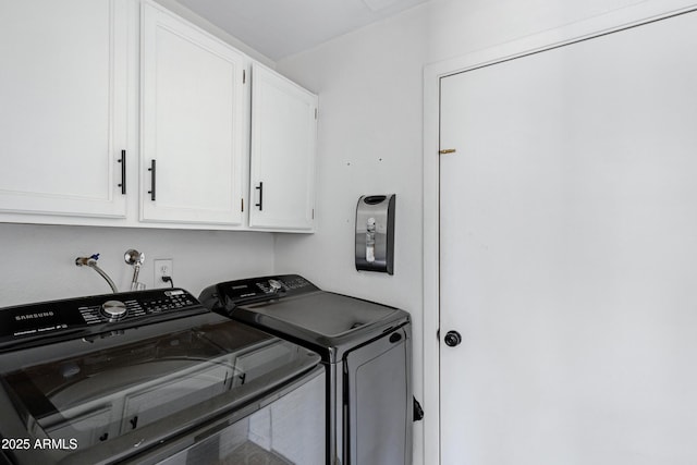 laundry area with cabinets and washer and dryer