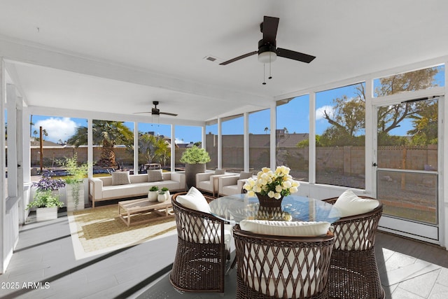 sunroom / solarium with ceiling fan