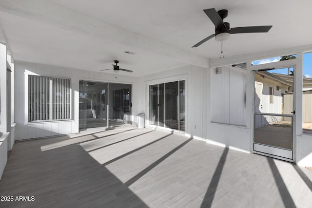 exterior space featuring ceiling fan