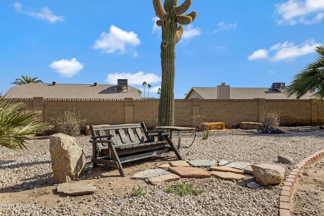 view of yard featuring central air condition unit