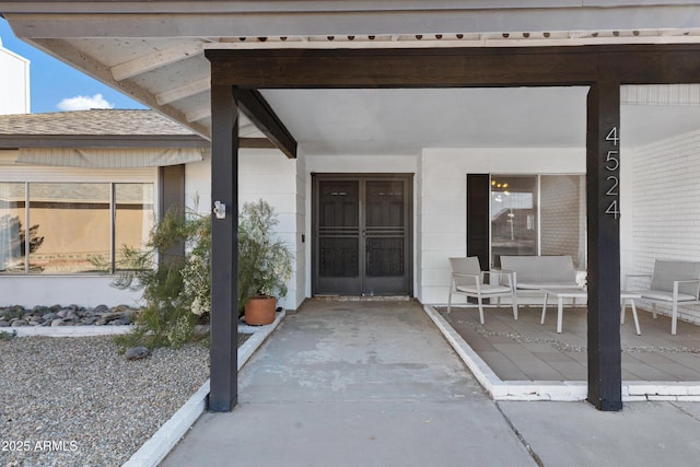 doorway to property featuring a patio area