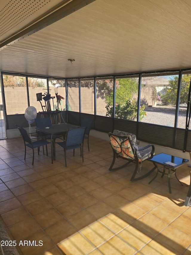 unfurnished sunroom with a wealth of natural light