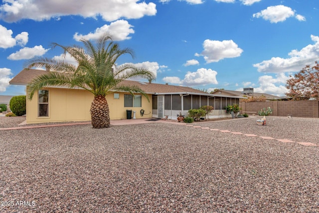 view of front of house featuring a patio area and a sunroom