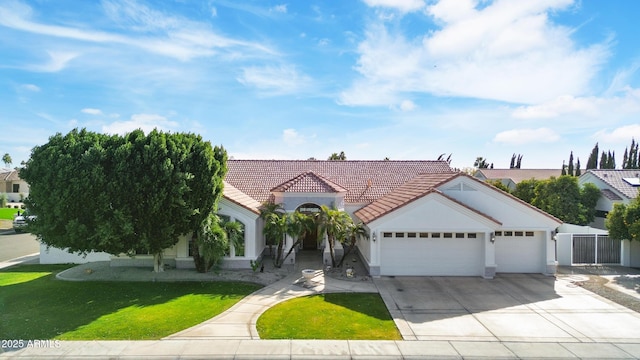 view of front of home featuring a garage and a front lawn