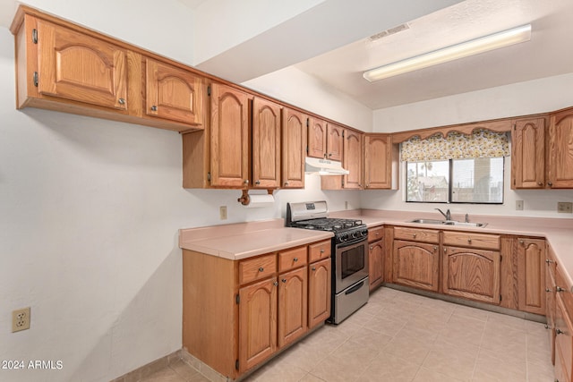 kitchen featuring stainless steel range with gas cooktop and sink