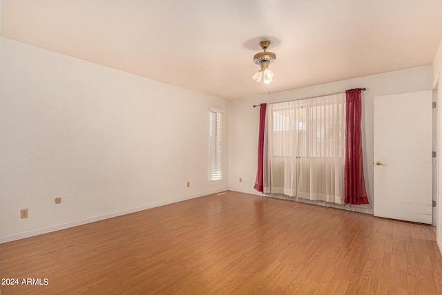 spare room with ceiling fan and light hardwood / wood-style floors