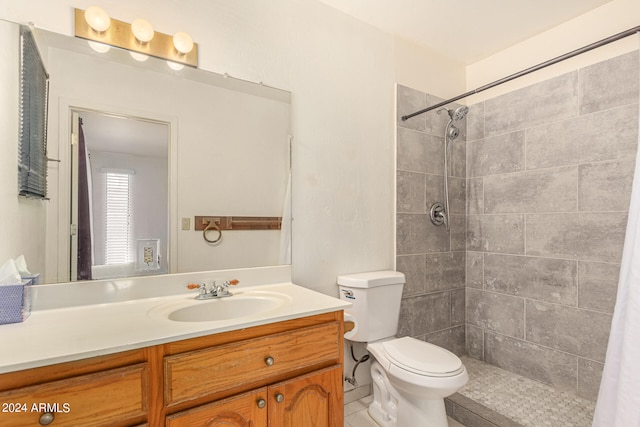 bathroom featuring vanity, toilet, and walk in shower