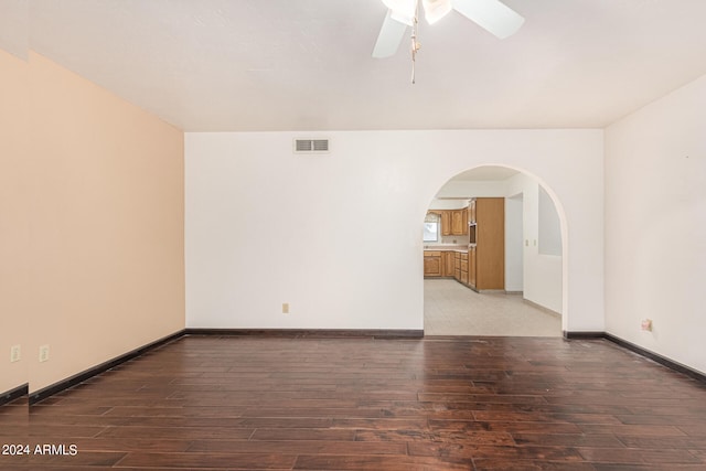 empty room featuring ceiling fan and wood-type flooring