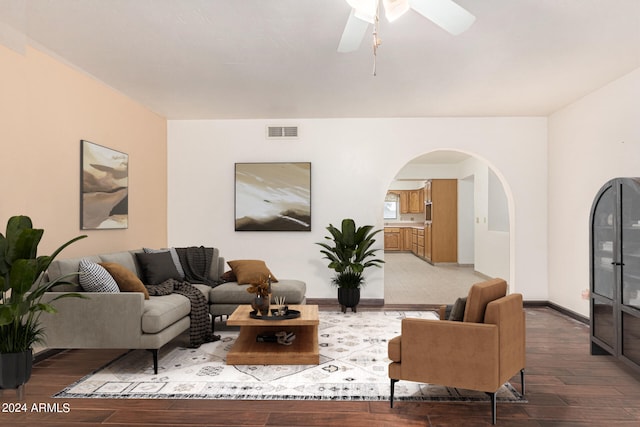 living room with ceiling fan and hardwood / wood-style floors