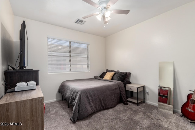 carpeted bedroom featuring baseboards, visible vents, and a ceiling fan