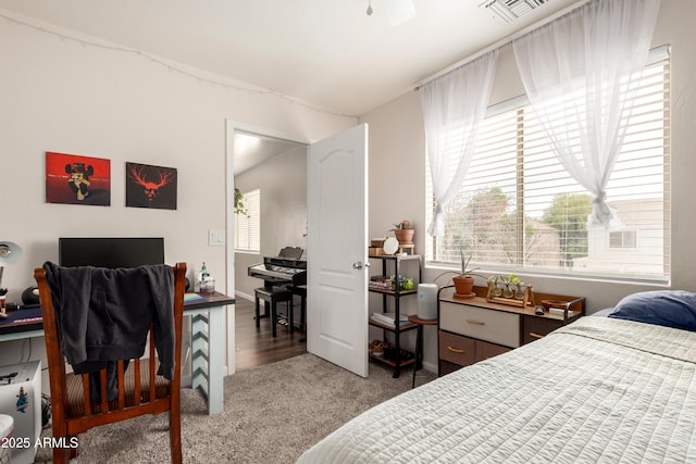 carpeted bedroom with visible vents