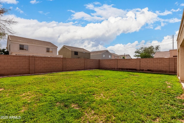view of yard with a fenced backyard