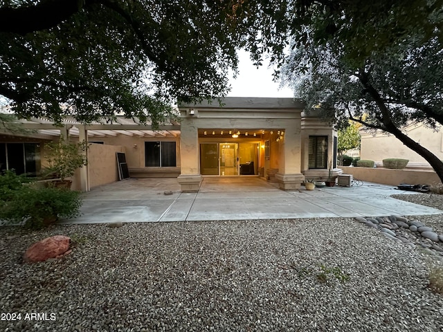 back of house with a patio