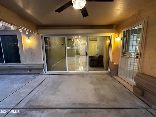 view of patio featuring ceiling fan