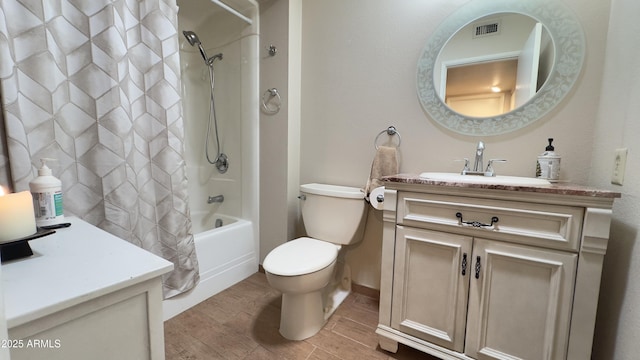 full bathroom featuring visible vents, wood tiled floor, toilet, vanity, and shower / bathtub combination with curtain