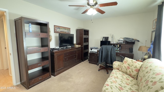 office space with light carpet and ceiling fan