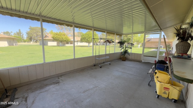 unfurnished sunroom with a residential view