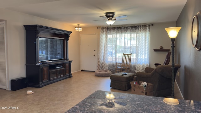 living area with ceiling fan