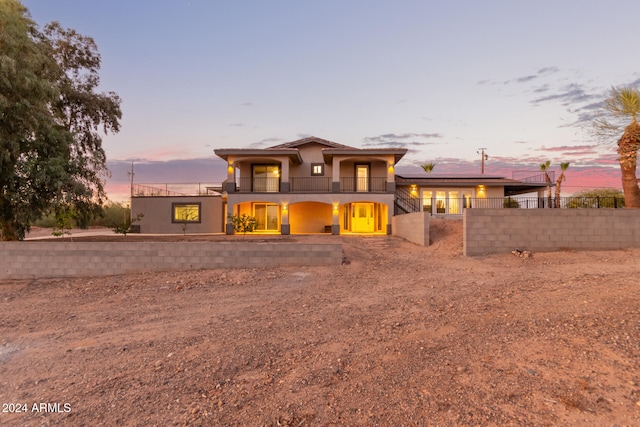 view of front of property featuring a balcony