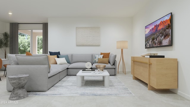 living area featuring baseboards