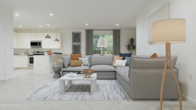 living area with recessed lighting and baseboards