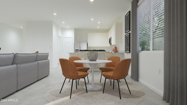 dining area with recessed lighting and baseboards