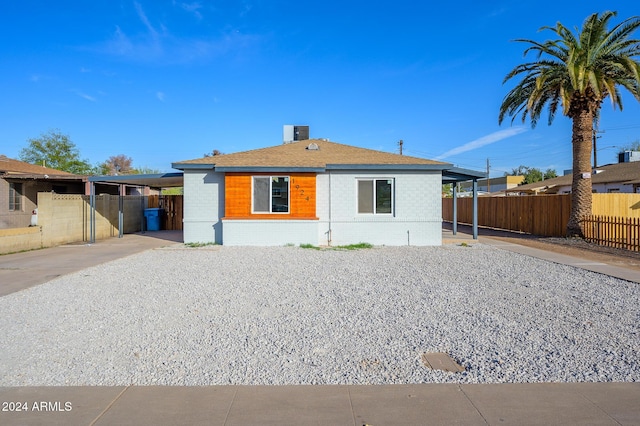 view of front of home with a carport