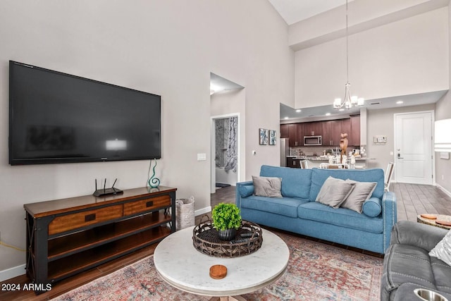 2511 W Queen Creek Rd Unit 425, Chandler, AZ 85248 - living area with baseboards, a towering ceiling, a chandelier, and recessed lighting