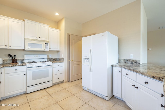 kitchen featuring white appliances, light tile patterned floors, light stone countertops, white cabinetry, and recessed lighting