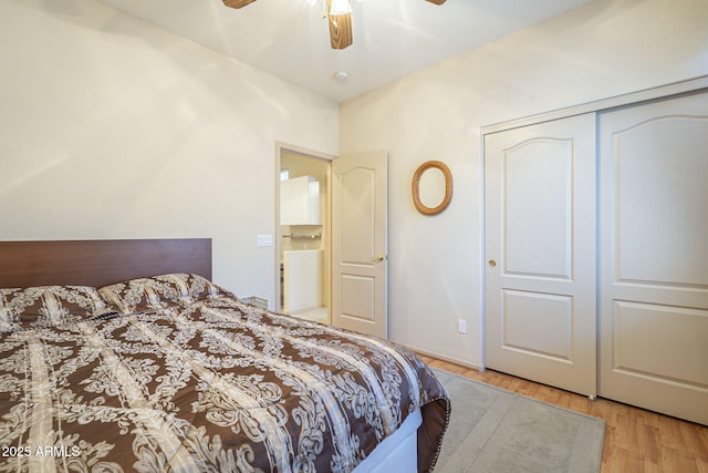 bedroom featuring a closet, wood finished floors, and a ceiling fan