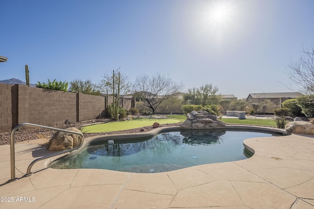 view of swimming pool featuring a patio area, a fenced backyard, and a fenced in pool