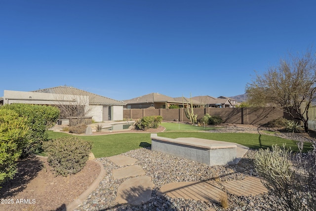 view of yard with a fenced backyard