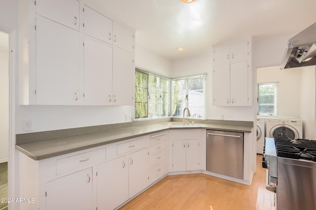 kitchen with white cabinetry, stainless steel dishwasher, and washer and dryer