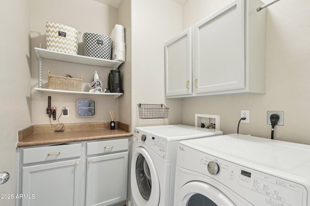 laundry area featuring cabinet space and independent washer and dryer