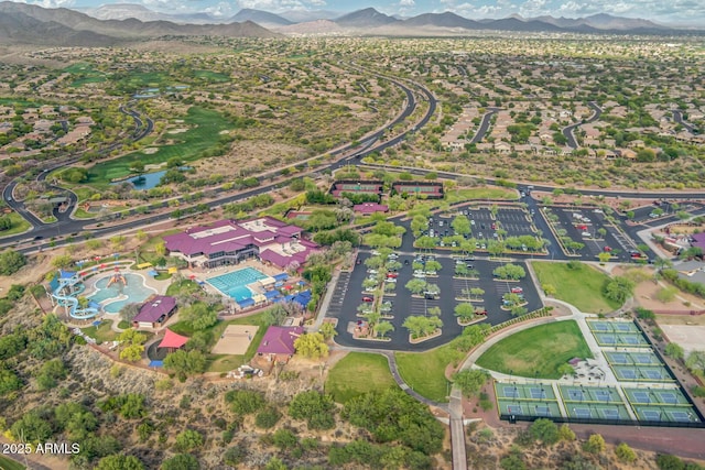 birds eye view of property with a mountain view