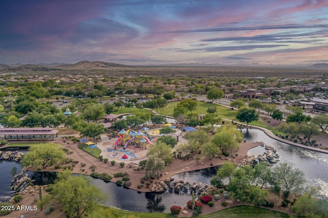 aerial view at dusk with a water and mountain view