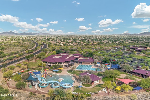 birds eye view of property featuring a mountain view