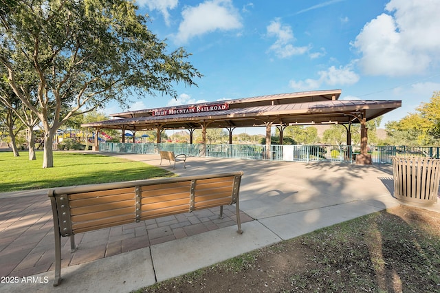 surrounding community featuring a yard and fence