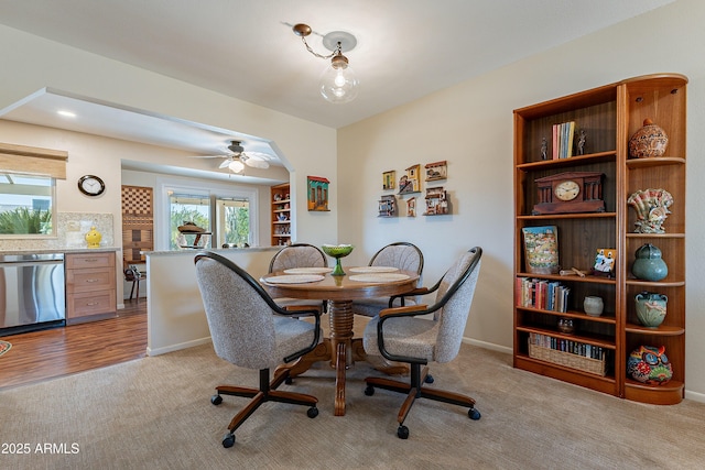 dining space with light colored carpet