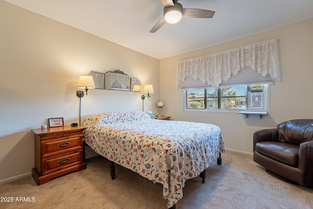 bedroom featuring ceiling fan and light carpet