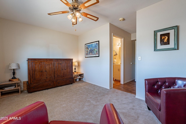 interior space with ceiling fan