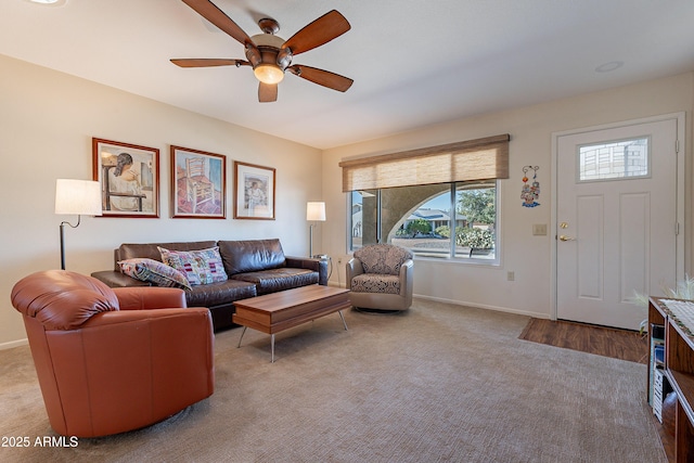 living room with light carpet and ceiling fan