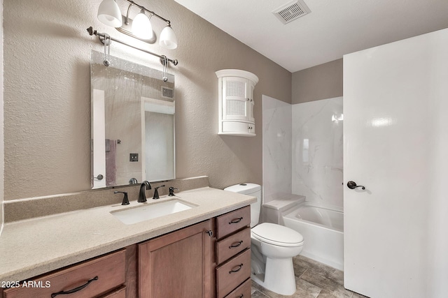 bathroom featuring visible vents, toilet, shower / bath combination, vanity, and a textured wall