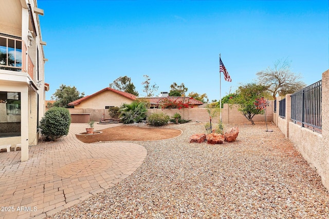 view of yard featuring a fenced backyard and a patio