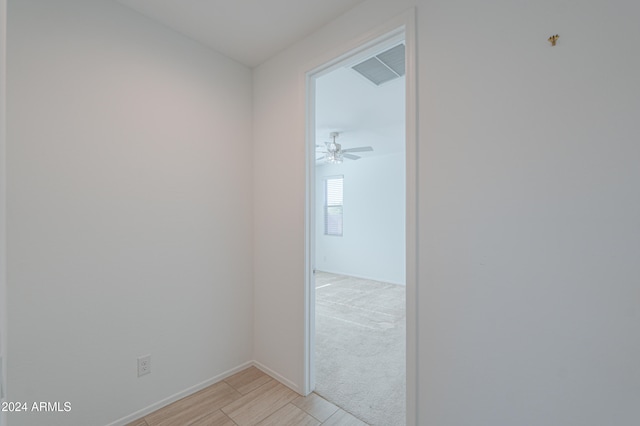 corridor with light colored carpet