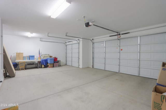 garage featuring a garage door opener