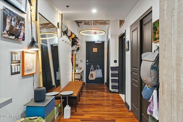 hall with dark hardwood / wood-style flooring