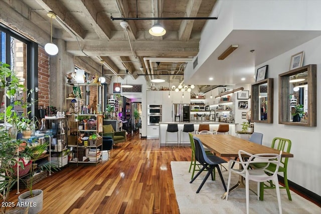 dining space featuring light hardwood / wood-style floors and sink