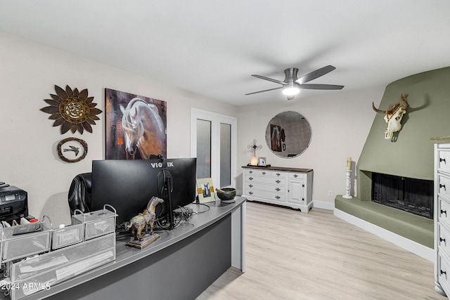 office featuring ceiling fan and light hardwood / wood-style floors