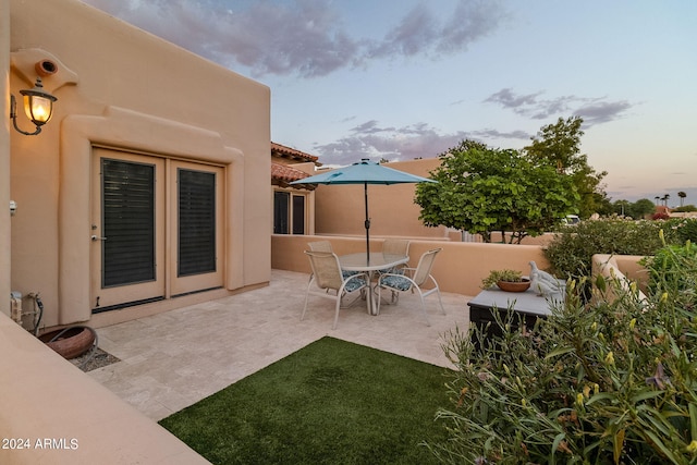 view of patio terrace at dusk